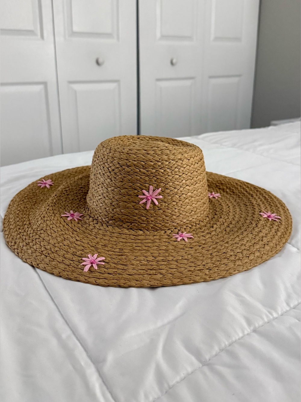 Straw Sun Hat with Pink Flower Embellishments